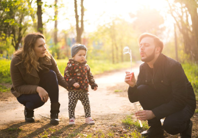 happy-parents-with-child-nature