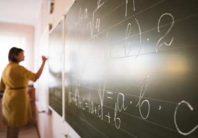 portrait-teacher-writing-chalkboard