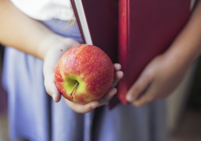 girl-uniform-with-apple-books-hands