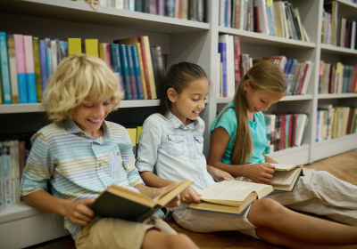 boy-two-girls-sitting-floor-reading-books